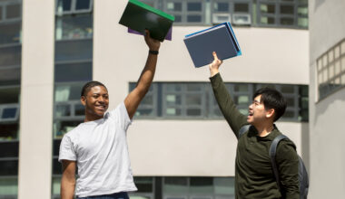 International students celebrating scholarship admission opportunities without IELTS at a university campus