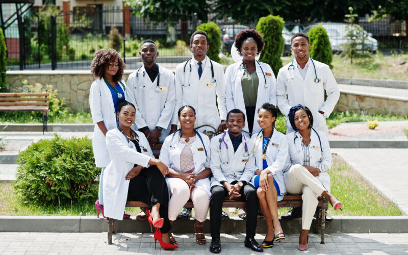 Public health scholarships for international students featuring diverse healthcare students at a university campus