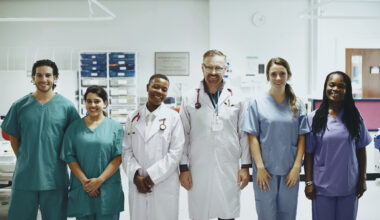 Professional international nurses and healthcare workers standing together in a modern hospital for global nursing career opportunities in 2026