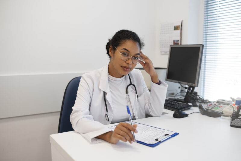 Healthcare professional working at a medical desk, representing entry-level healthcare jobs no experience opportunities