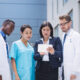 Healthcare workers abroad programs featuring international medical professionals reviewing patient information in a modern hospital