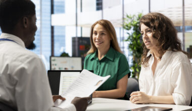 Recruiters reviewing an ATS Healthcare Resume during a healthcare job interview.