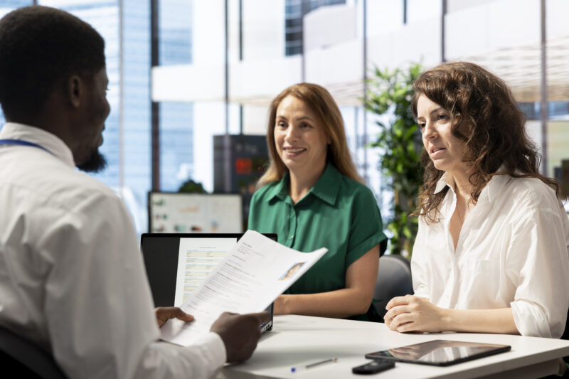 Recruiters reviewing an ATS Healthcare Resume during a healthcare job interview.