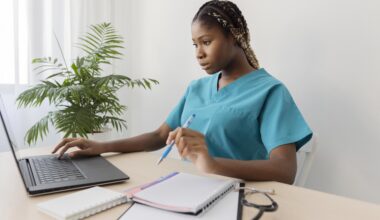 A healthcare professional building a Healthcare LinkedIn Profile on a laptop for better job opportunities