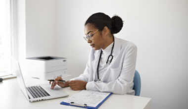 A healthcare professional writing a Healthcare Cover Letter for a job application